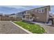 Beautifully landscaped backyard with stone accents, a deck and great views of surrounding greenery at 6172 N Liverpool St, Aurora, CO 80019