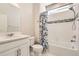 Clean bathroom with decorative shower curtain and modern shower fixtures at 6172 N Liverpool St, Aurora, CO 80019