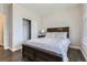 Spacious bedroom with a closet, dark wood furniture, and ample natural light at 6172 N Liverpool St, Aurora, CO 80019