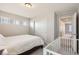 Cozy bedroom with bright windows, a white crib, and plenty of space at 6172 N Liverpool St, Aurora, CO 80019