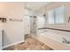Stylish bathroom showcases a soaking tub, glass-enclosed shower, and modern fixtures at 7922 S Algonquian Way, Aurora, CO 80016