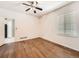 Bedroom with wood floors, neutral walls, and a ceiling fan at 7922 S Algonquian Way, Aurora, CO 80016