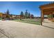 Outdoor bocce ball court with covered seating and beautiful landscaping at 7922 S Algonquian Way, Aurora, CO 80016