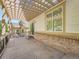 Relaxing covered patio boasts a brick base, pergola, and ample room for outdoor enjoyment at 7922 S Algonquian Way, Aurora, CO 80016