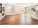 Spacious living room featuring hardwood floors, modern lighting, and neutral decor at 7922 S Algonquian Way, Aurora, CO 80016