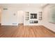 Cozy living room featuring modern built-ins and a sleek electric fireplace at 7922 S Algonquian Way, Aurora, CO 80016