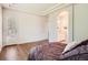 Spacious main bedroom with ensuite bathroom access, hardwood floors and natural light at 7922 S Algonquian Way, Aurora, CO 80016