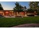 Inviting backyard featuring a spacious patio, modern furniture, lush lawn, and seamless indoor-outdoor living at 101 S Humboldt St, Denver, CO 80209