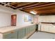 Finished basement with workbench and storage cabinets offers a versatile space for hobbies and projects at 101 S Humboldt St, Denver, CO 80209