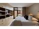 Bedroom featuring built-in storage, shelving, TV, and access to private outdoor space at 101 S Humboldt St, Denver, CO 80209