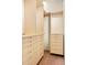 Modern closet featuring light wood cabinetry with multiple drawers and ample hanging storage space at 101 S Humboldt St, Denver, CO 80209