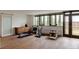 Bright exercise room featuring wood floors, large windows, and a variety of workout equipment at 101 S Humboldt St, Denver, CO 80209
