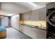 Well-organized laundry room with sleek cabinetry, counter space, and modern washer and dryer units at 101 S Humboldt St, Denver, CO 80209