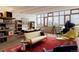 Bright living room with a piano, lots of light, seating, and hardwood floors at 101 S Humboldt St, Denver, CO 80209