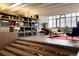 Stylish living area featuring built-in shelving, wood accents, and ample natural light at 101 S Humboldt St, Denver, CO 80209
