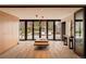 Modern living area with hardwood floors, recessed lighting, and backyard access at 101 S Humboldt St, Denver, CO 80209