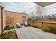 Cozy outdoor patio area with garden, brick wall, decorative fence, and comfortable seating at 101 S Humboldt St, Denver, CO 80209