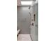 Modern bathroom shower with tiled walls, shower head, and glass door enclosure at 101 S Humboldt St, Denver, CO 80209