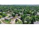 Scenic aerial view of a residential neighborhood with mature trees and well-maintained homes at 11542 W 29Th Pl, Lakewood, CO 80215