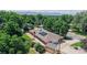 Aerial view showcases the home, large lot, solar panels, and mountain views at 11542 W 29Th Pl, Lakewood, CO 80215