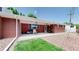 Relaxing covered back patio with a barbecue area and a beautiful view of the yard and landscaping at 11542 W 29Th Pl, Lakewood, CO 80215