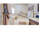 Bathroom featuring a soaking tub with tile surround and decorative accents at 11542 W 29Th Pl, Lakewood, CO 80215