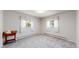 Minimalist bedroom with neutral walls, carpet, and windows for natural light at 11542 W 29Th Pl, Lakewood, CO 80215
