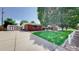 Brick exterior of a single-Gathering home featuring a well-manicured lawn and mature trees at 11542 W 29Th Pl, Lakewood, CO 80215