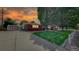 Beautiful home with a well-manicured front yard, mature trees, and a long driveway at 11542 W 29Th Pl, Lakewood, CO 80215