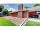Beautiful home features an exterior with a chimney, covered patio, and well-kept yard and landscaping at 11542 W 29Th Pl, Lakewood, CO 80215