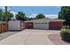 Detached two-car garage with extended driveway and matching storage shed at 11542 W 29Th Pl, Lakewood, CO 80215