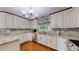 Well-lit kitchen with granite countertops, stainless steel appliances and hardwood floors at 11542 W 29Th Pl, Lakewood, CO 80215
