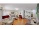 Open-concept living room boasting hardwood floors and ample seating at 11542 W 29Th Pl, Lakewood, CO 80215