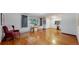 Bright living room showcasing gleaming hardwood floors and a cozy seating area at 11542 W 29Th Pl, Lakewood, CO 80215