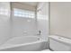 Clean bathroom featuring a bathtub with tiled walls, providing a refreshing space at 3261 S Waco Ct # C, Aurora, CO 80013