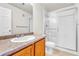 Bathroom features a single sink vanity, a toilet, and a glass enclosed shower at 3261 S Waco Ct # C, Aurora, CO 80013