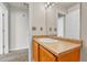 Bright bathroom features a single sink vanity, large mirror and bright lighting at 3261 S Waco Ct # C, Aurora, CO 80013