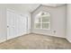Carpeted bedroom with vaulted ceiling, closet, and bright window for a comfortable space at 3261 S Waco Ct # C, Aurora, CO 80013