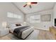 Vaulted ceiling bedroom with neutral decor, carpet, and modern furnishings for a relaxing retreat at 3261 S Waco Ct # C, Aurora, CO 80013