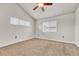 Bright bedroom with vaulted ceiling and carpeted floors, ready for your personal touch at 3261 S Waco Ct # C, Aurora, CO 80013
