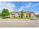 Multi-Gathering condominium with stone accents, exterior stairs, and well-maintained landscaping at 3261 S Waco Ct # C, Aurora, CO 80013