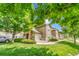 Exterior of property showing a well-manicured lawn, patio and green tree at 3261 S Waco Ct # C, Aurora, CO 80013