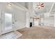 Bright living room featuring fireplace, ceiling fan, and easy access to kitchen at 3261 S Waco Ct # C, Aurora, CO 80013