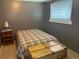 Cozy bedroom with carpet floors, a chest and plenty of room for furnishings at 4393 Pima Rd, Indian Hills, CO 80454