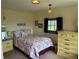 Quaint bedroom with hardwood floors and decorative lighting at 4393 Pima Rd, Indian Hills, CO 80454