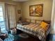 Cozy bedroom with hard wood floors and a daybed for relaxing and sleeping at 4393 Pima Rd, Indian Hills, CO 80454