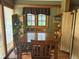 Cozy dining room with natural light and wood table for intimate gatherings at 4393 Pima Rd, Indian Hills, CO 80454