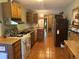 Functional kitchen with ample cabinet space and a gas range, plus tile flooring at 4393 Pima Rd, Indian Hills, CO 80454