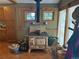 Bright kitchen featuring an antique wood-burning stove and charming details at 4393 Pima Rd, Indian Hills, CO 80454