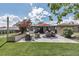 Beautiful backyard patio with a dining set, outdoor grill, and landscaping; perfect for gatherings at 4930 Gray St, Denver, CO 80212